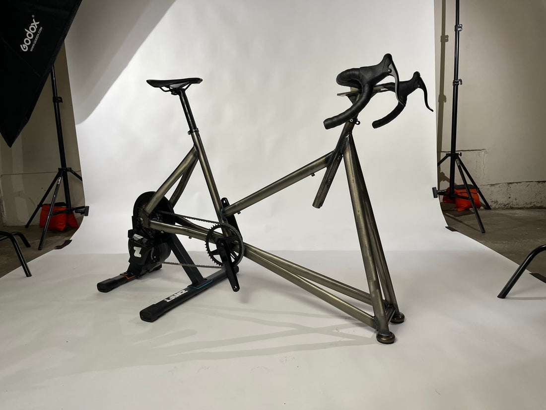 The caveworks prototype direct-drive indoor cycling bike paired to the Zwift Hub smart trainer and equipped with a wireless SRAM Apex/Rival AXS groupset.