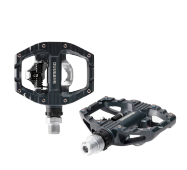 Two Shimano bicycle pedals on a white background